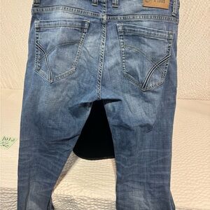 Judy Blue Medium Blue Distressed Back Pocket Jeans.